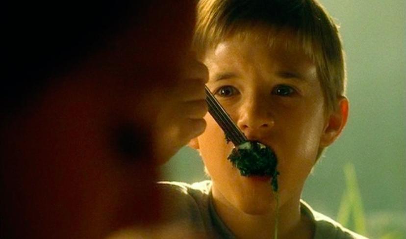 Child from the movie AI eating spinach
