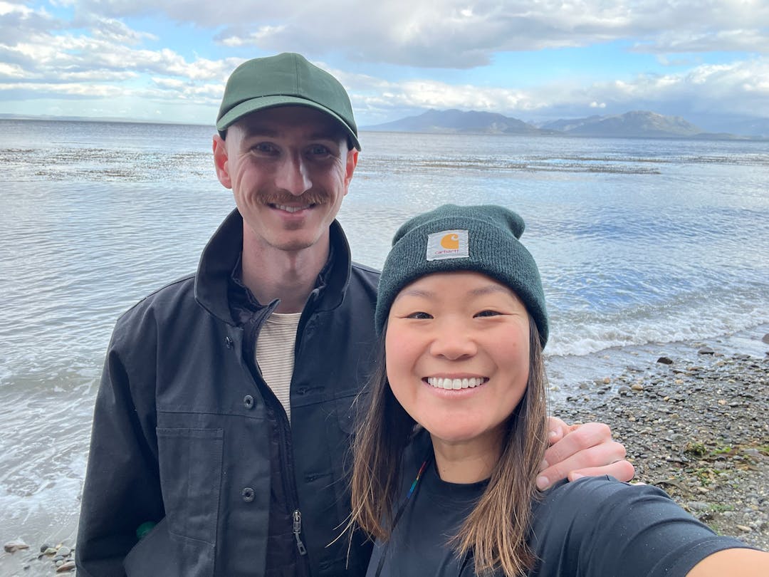 selfie of Patrick and Courtney on the shore of the Beagle Channel