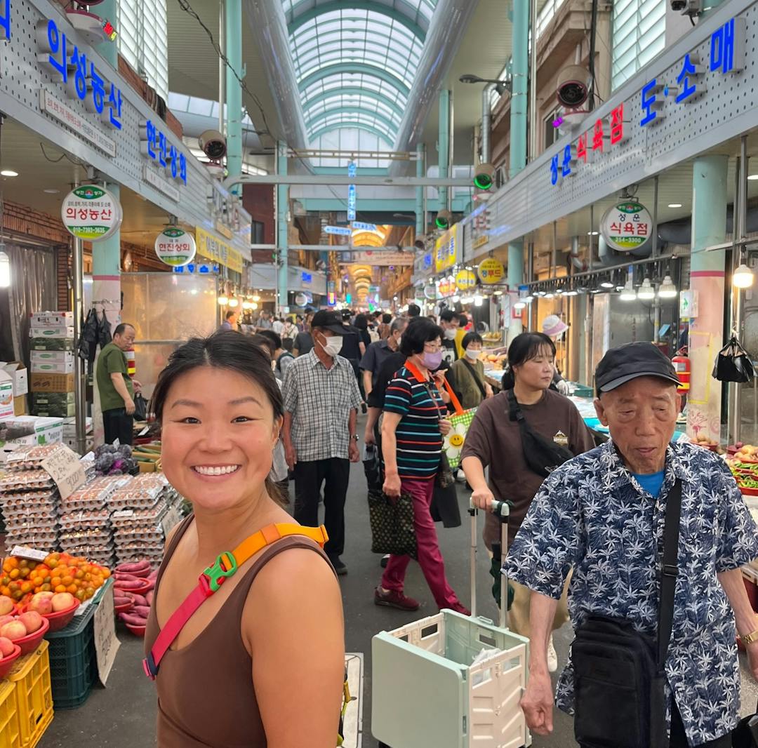 Courtney standing in a market in Busan