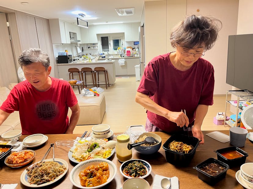 Courtney's relatives setting out a Korean dinner